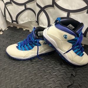 Jordan size 10.5 White, purple, and turquoise.